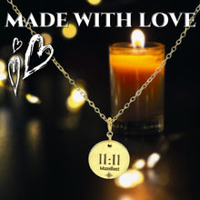 Load image into Gallery viewer, Gold necklace with a pendant labeled '11:11 Manifest' in front of a lit candle on a dark background.