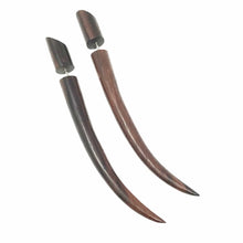 Load image into Gallery viewer, A pair of brown, vampy gothic style fake illusion taper earrings laid out on a plain background.