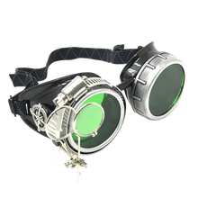 Load image into Gallery viewer, Steampunk goggles with green lenses and metal accents on a white background