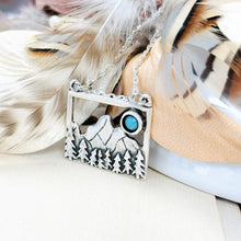 Load image into Gallery viewer, Necklace with mountain and turquoise stone pendant on feathers