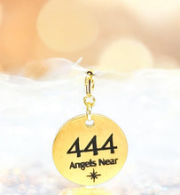 Load image into Gallery viewer, Gold charm with '444 Angels Near' text on a soft white background