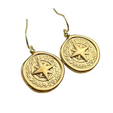 Load image into Gallery viewer, Gold earrings with star design on a white background