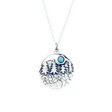Load image into Gallery viewer, Necklace with a pendant featuring trees and a moon on a white background