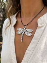Load image into Gallery viewer, Close-up detail of antique silver dragonfly pendant on collarbone and black leather cord