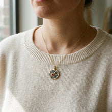 Load image into Gallery viewer, Gold sun and moon coin medallion necklace worn on model with knit sweater